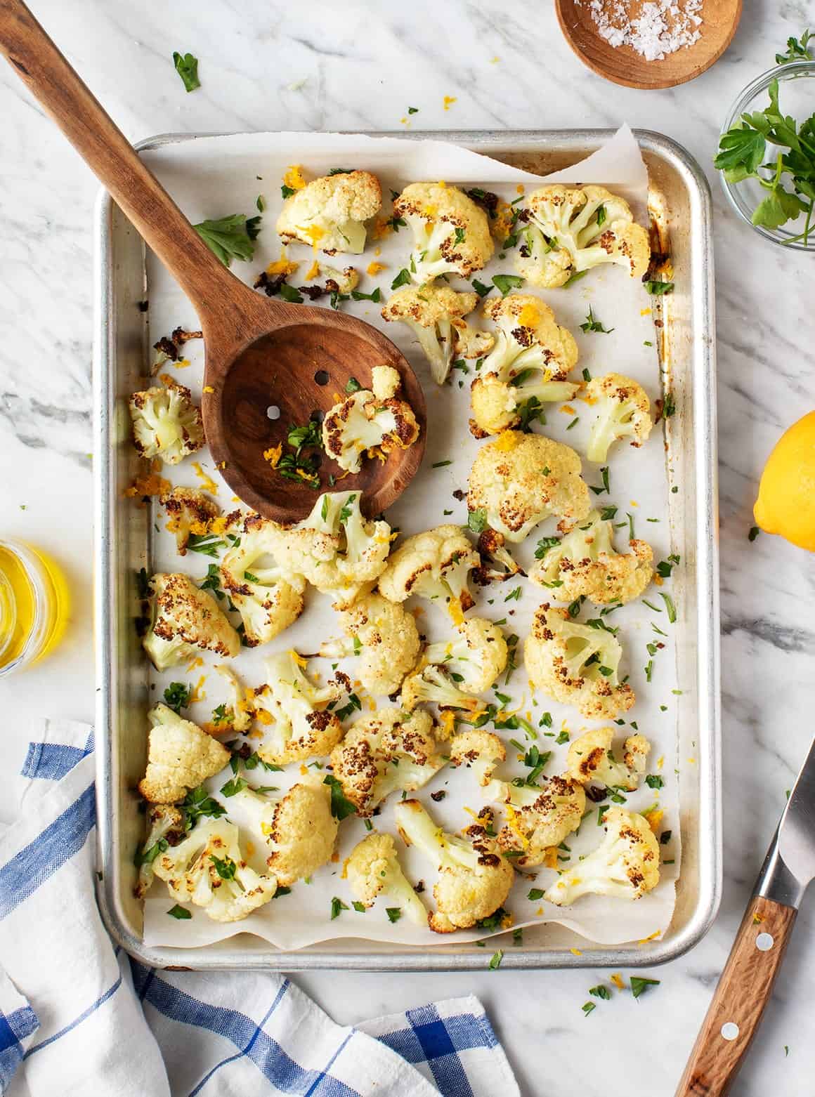 Oven Roasted Cauliflower on baking sheet with wooden spoon